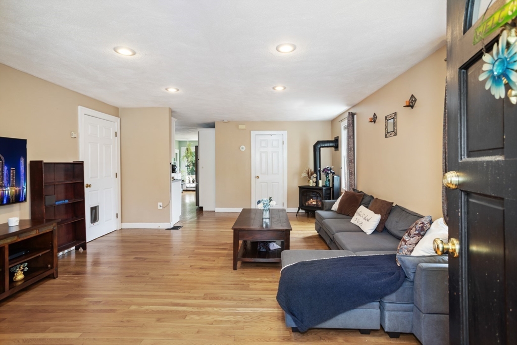 2 Allen Road Billerica, MA 01821 - Photo 8 of 32 a living room with furniture and a flat screen tv