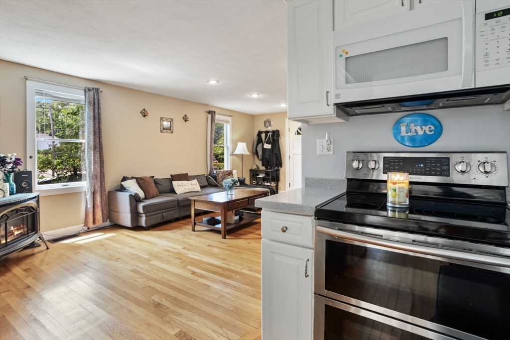 2 Allen Road Billerica, MA 01821 - Photo 10 of 32 a kitchen with a stove and a microwave
