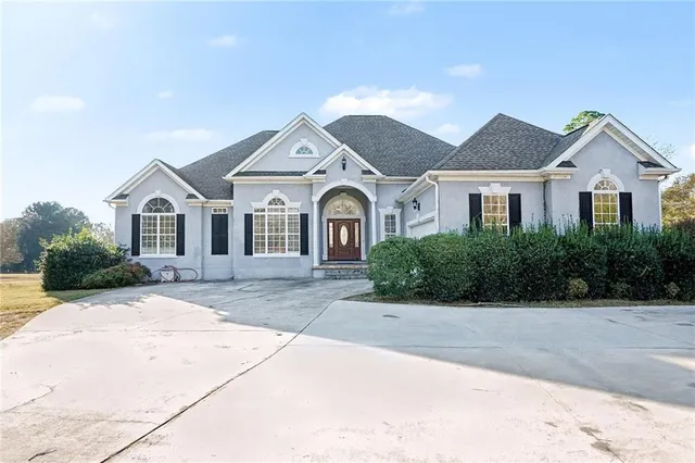 a front view of a house with yard