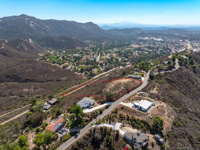 an aerial view of residential house and green space