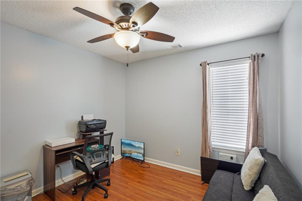 4496 Jackam Ridge Court Lithonia, GA 30038 - Photo 18 of 24 a view of a workspace with furniture and a window