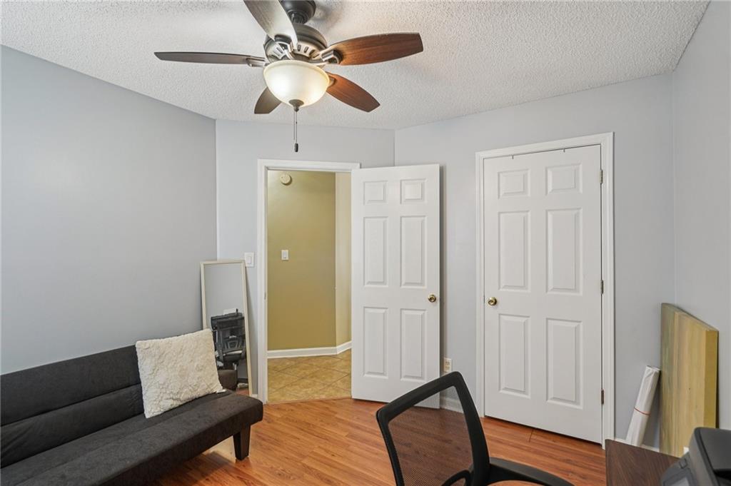 4496 Jackam Ridge Court Lithonia, GA 30038 - Photo 19 of 24 a living room with furniture and a wooden floor