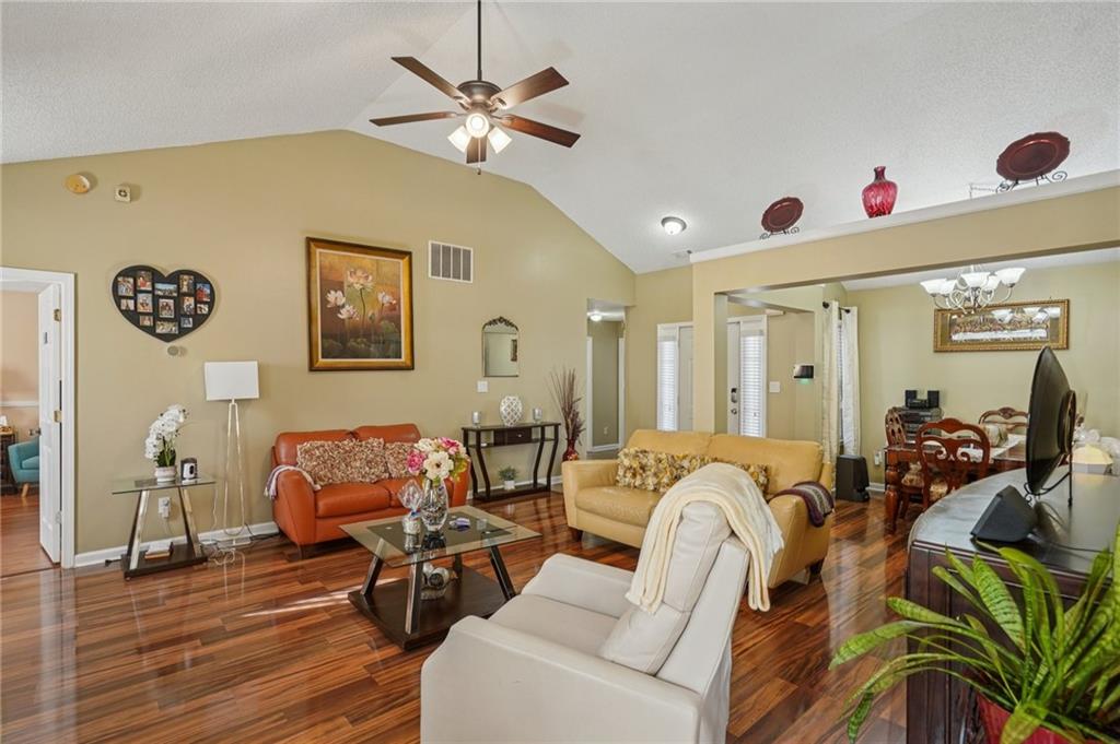 4496 Jackam Ridge Court Lithonia, GA 30038 - Photo 6 of 24 a living room with furniture and wooden floor