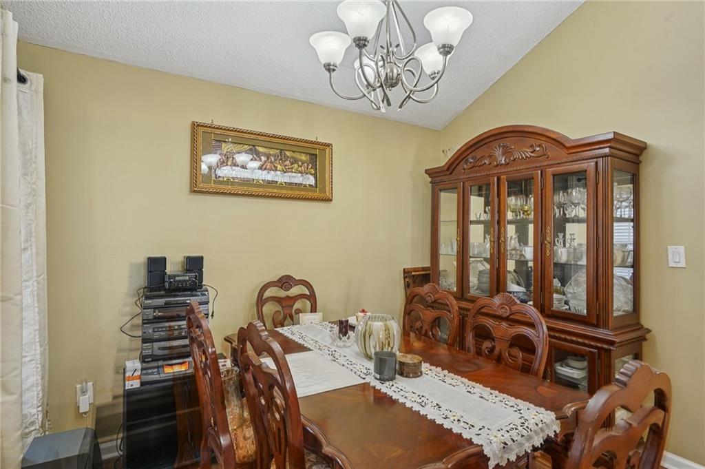 4496 Jackam Ridge Court Lithonia, GA 30038 - Photo 7 of 24 a view of a room with furniture wooden floor and window