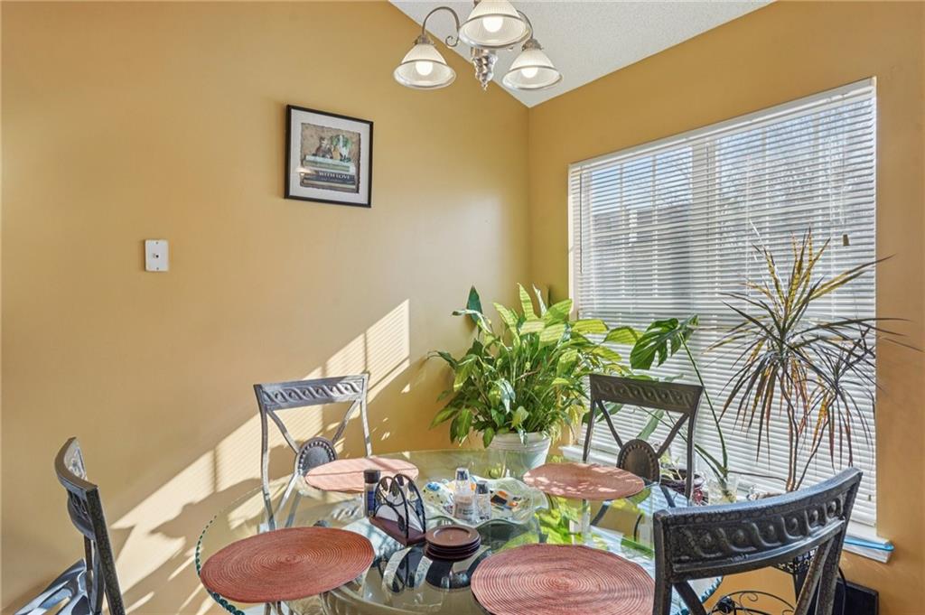 4496 Jackam Ridge Court Lithonia, GA 30038 - Photo 10 of 24 a dining room with furniture and wooden floor