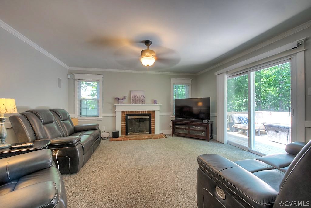 13908 Shadow Ridge Lane Midlothian, VA 23112 - Photo 17 of 35 a living room with furniture a fireplace and a flat screen tv