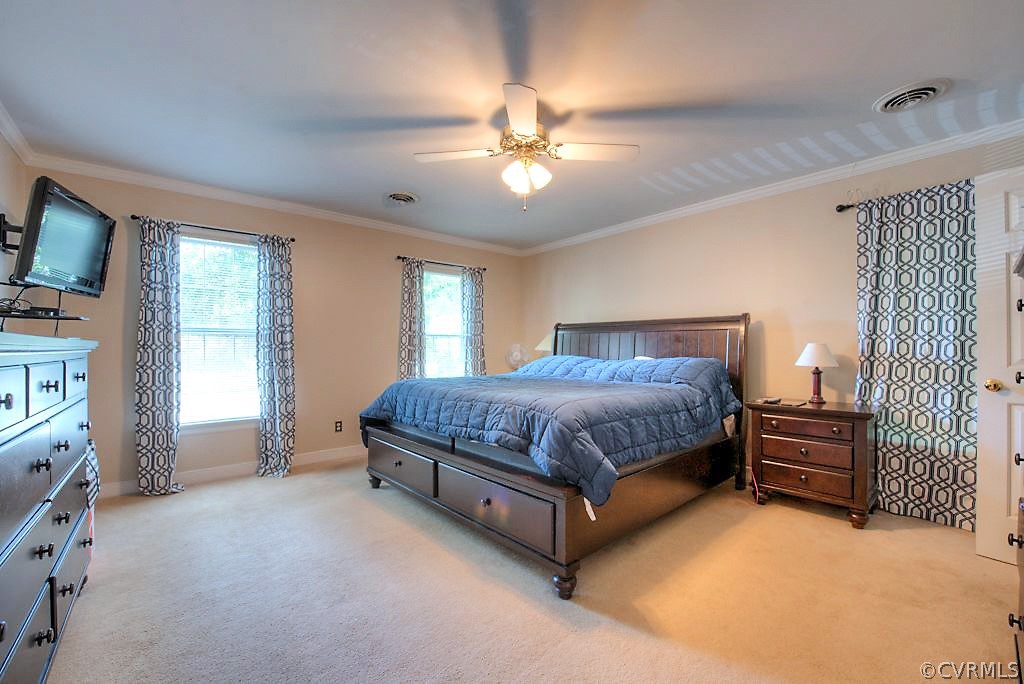 13908 Shadow Ridge Lane Midlothian, VA 23112 - Photo 22 of 35 a bedroom with a bed dresser and a flat tv screen