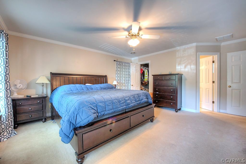 13908 Shadow Ridge Lane Midlothian, VA 23112 - Photo 23 of 35 a bedroom with a bed and a chandelier