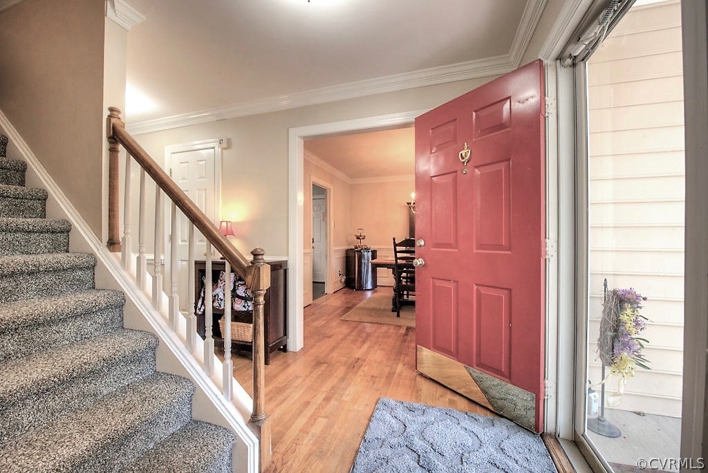 13908 Shadow Ridge Lane Midlothian, VA 23112 - Photo 3 of 35 a view of a hallway with wooden floor and staircase