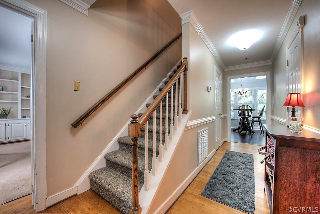 13908 Shadow Ridge Lane Midlothian, VA 23112 - Photo 4 of 35 a view of entryway and hall with wooden floor