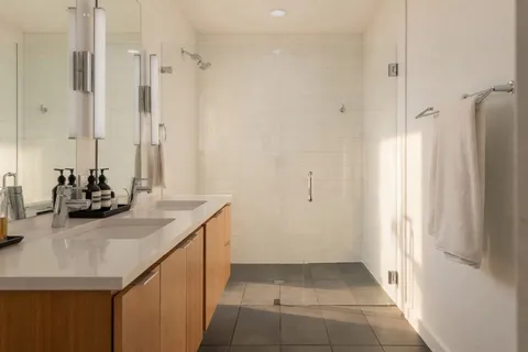 a bathroom with a sink a vanity and a mirror