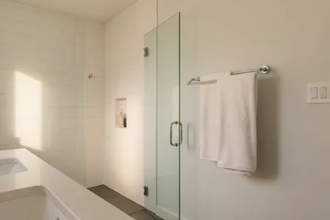 a bathroom with a shower and a sink