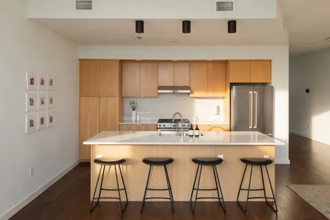 a kitchen with a table and chairs in it