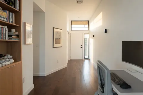 a view of a workspace with furniture and staircase