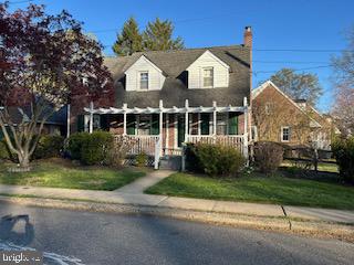 101 Summit Road Media, PA 19063 - Photo 1 of 6 a front view of a house with a garden and plants