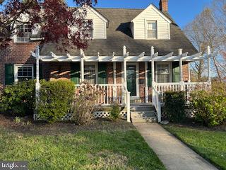 101 Summit Road Media, PA 19063 - Photo 3 of 6 a front view of a house with a garden