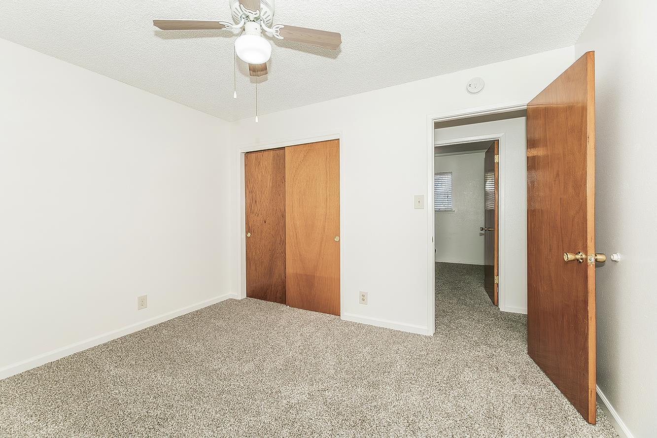 1064 East Early Avenue Reedley, CA 93654 - Photo 14 of 36 a view of an empty room and chandelier fan