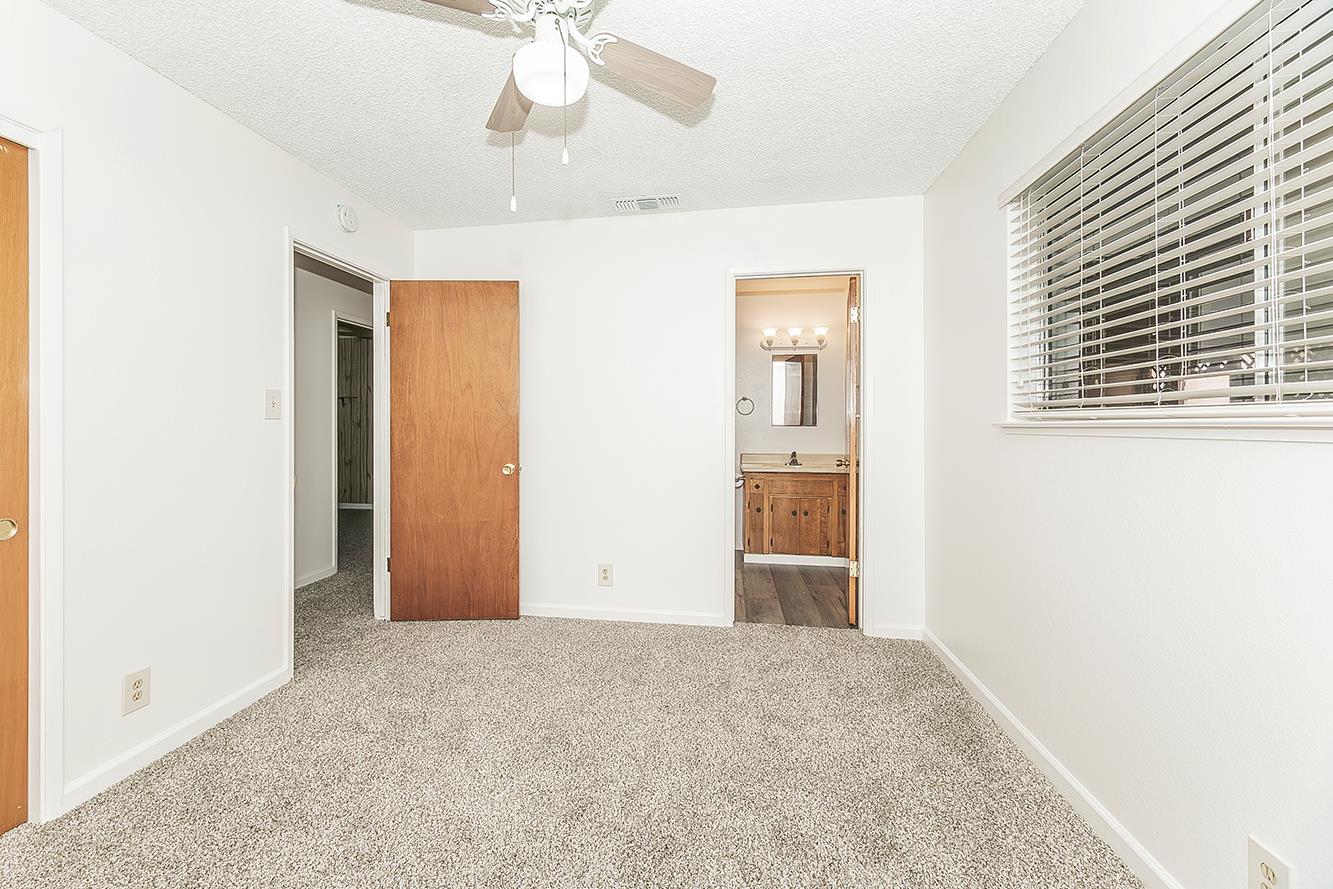 1064 East Early Avenue Reedley, CA 93654 - Photo 15 of 36 an empty room with windows and closet