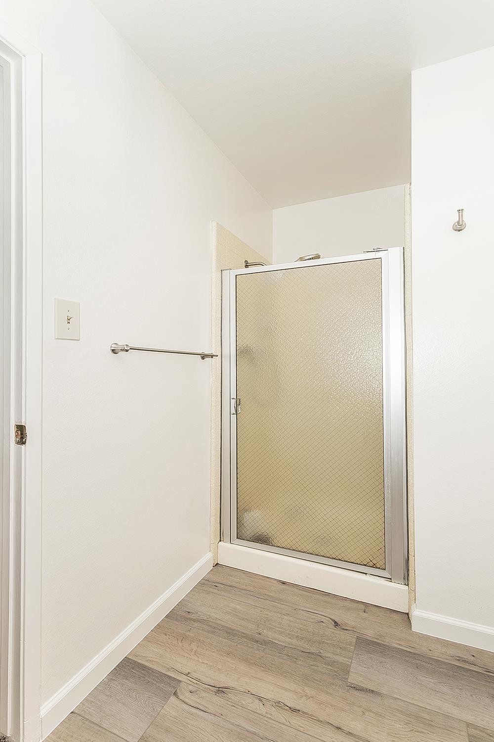 1064 East Early Avenue Reedley, CA 93654 - Photo 17 of 36 a view of a small space with wooden floor