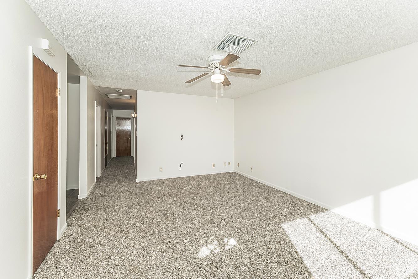 1064 East Early Avenue Reedley, CA 93654 - Photo 2 of 36 a view of a big room with carpet