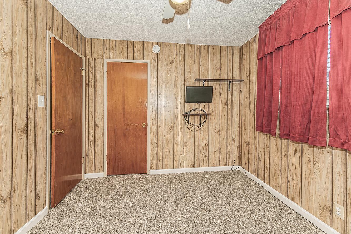 1064 East Early Avenue Reedley, CA 93654 - Photo 21 of 36 a view of a entryway with wooden walls