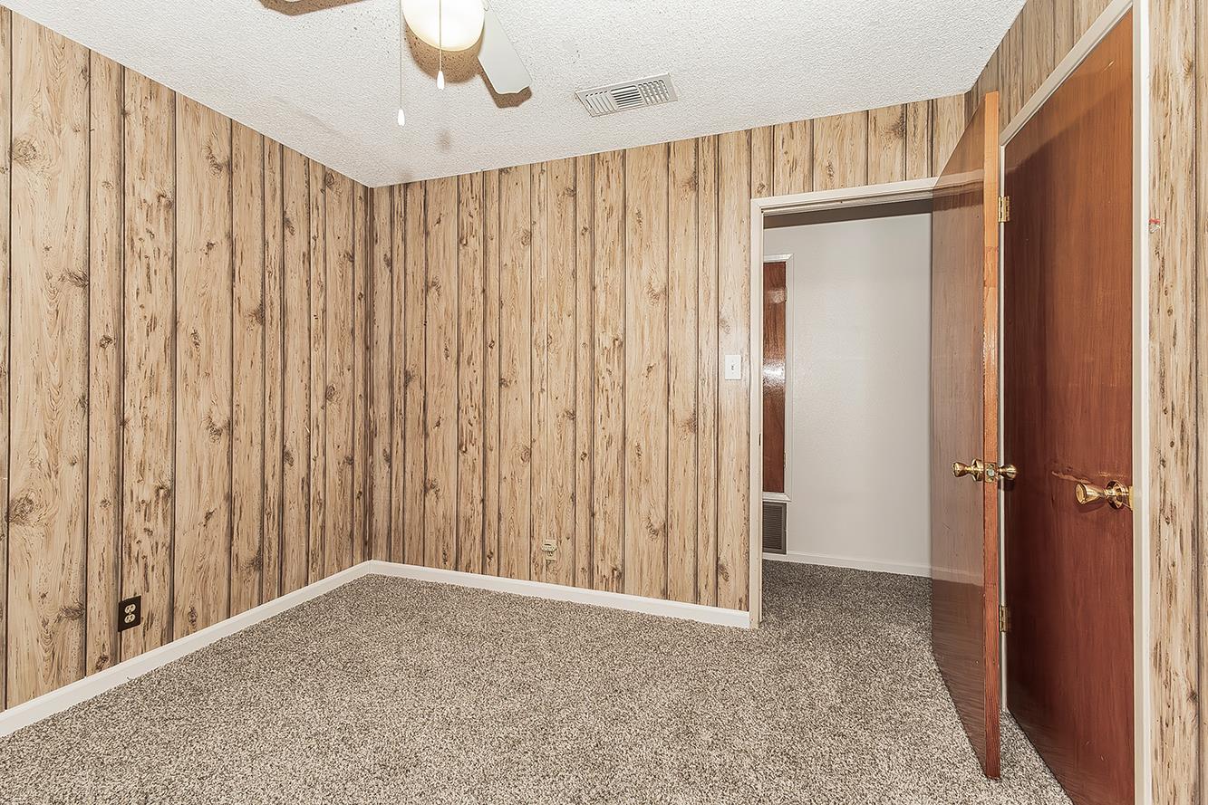 1064 East Early Avenue Reedley, CA 93654 - Photo 22 of 36 a view of a room with a wooden walls