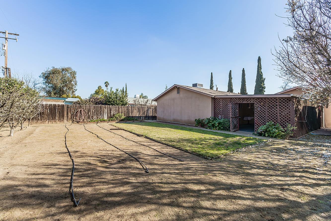 1064 East Early Avenue Reedley, CA 93654 - Photo 28 of 36 a view of a house with a yard