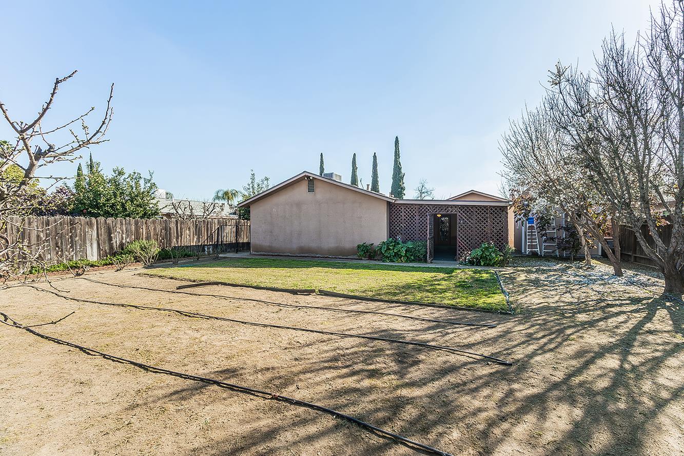 1064 East Early Avenue Reedley, CA 93654 - Photo 29 of 36 a view of a house with a yard