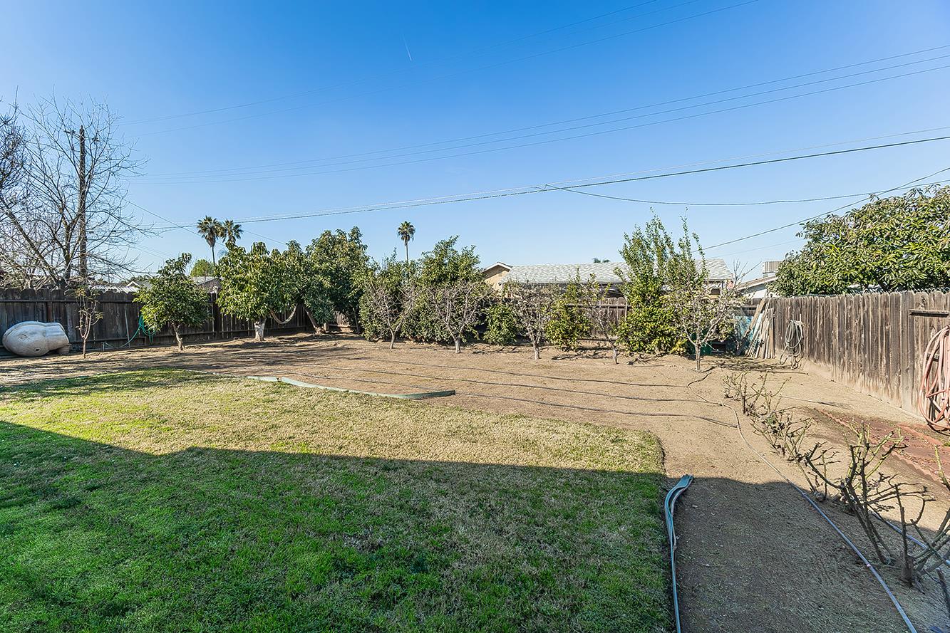 1064 East Early Avenue Reedley, CA 93654 - Photo 30 of 36 a view of a house with a yard