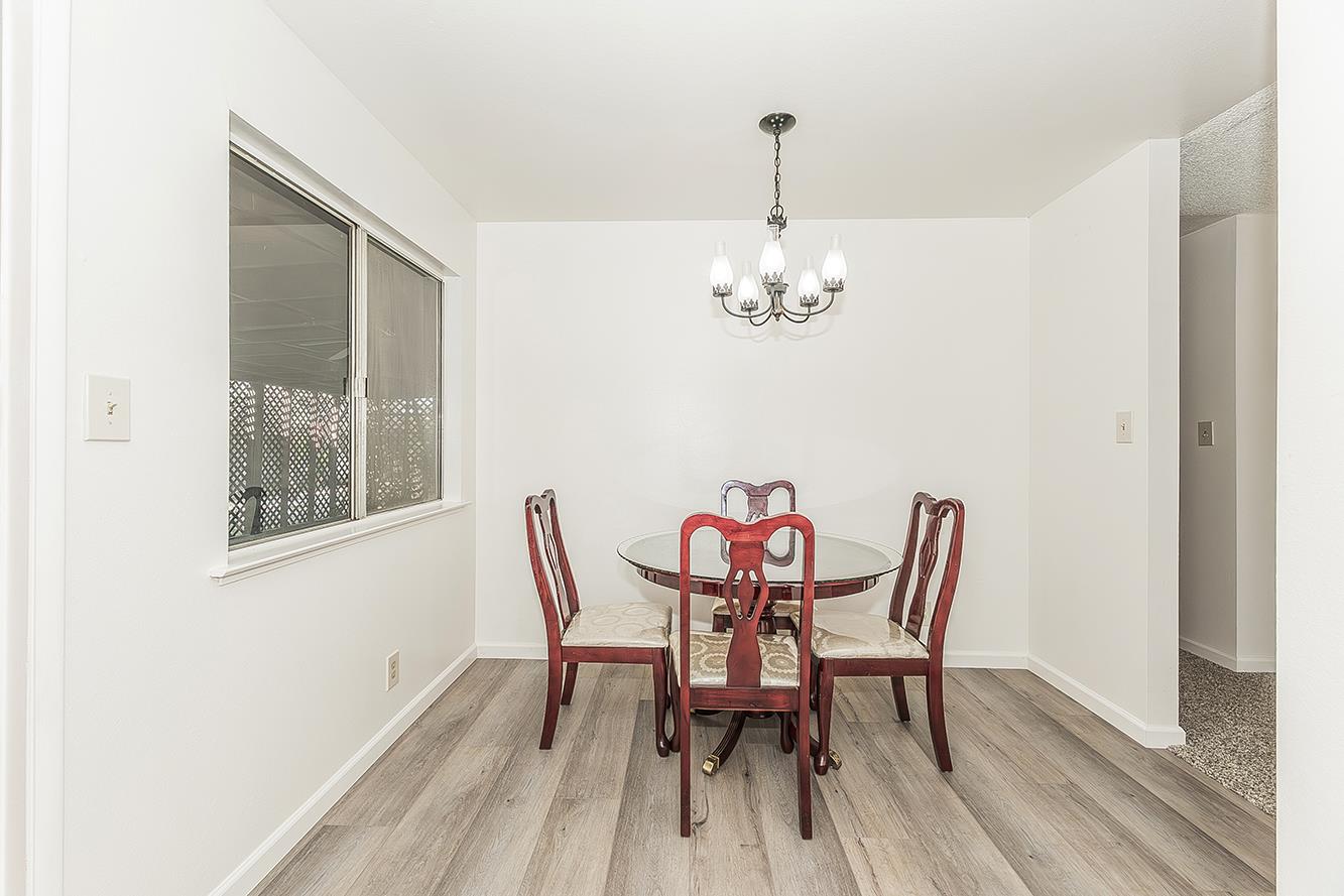 1064 East Early Avenue Reedley, CA 93654 - Photo 6 of 36 a dining room with furniture and chandelier