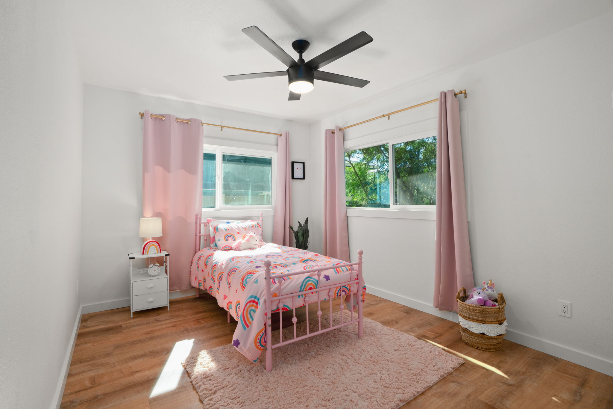 8556 Elepaio Road, Unit B Kekaha, HI 96752 - Photo 22 of 24 a bedroom with a bed and a window