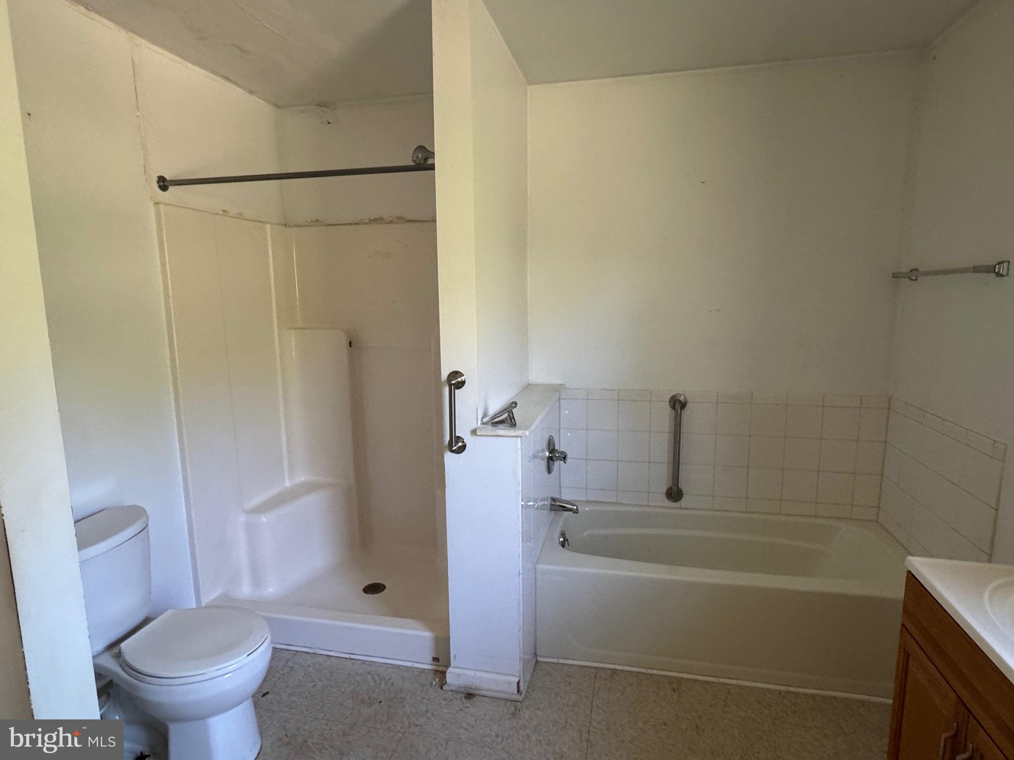 24876 Meeting House Road Denton, MD 21629 - Photo 3 of 15 a bathroom with a bathtub and a shower