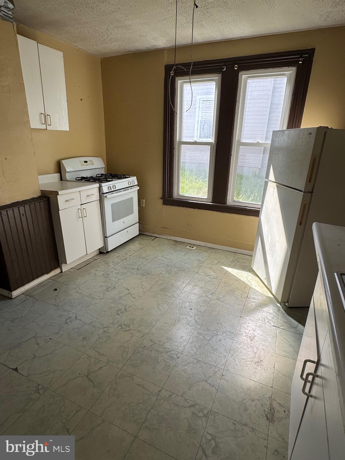 24876 Meeting House Road Denton, MD 21629 - Photo 4 of 15 a view of a kitchen with furniture and a window