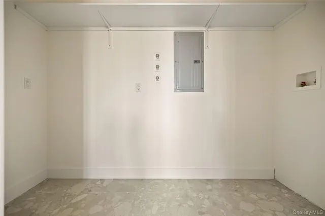 a view of an entryway with wooden floor