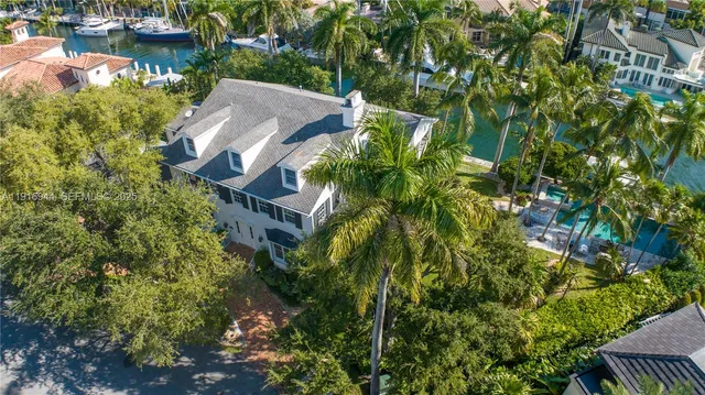 a aerial view of a house with a lake view