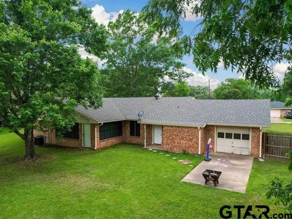 a view of backyard with green space
