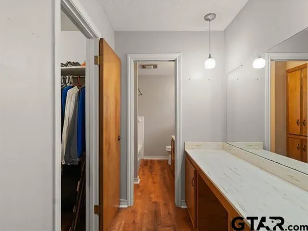 a view of a kitchen from the hallway