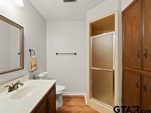 a view of an entryway with wooden floor