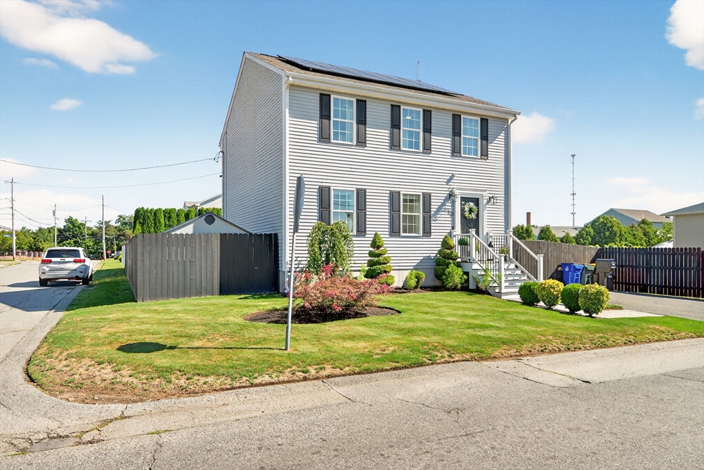 750 Cambridge Street Fall River, MA 02721 - Photo 1 of 38 a front view of a house with garden