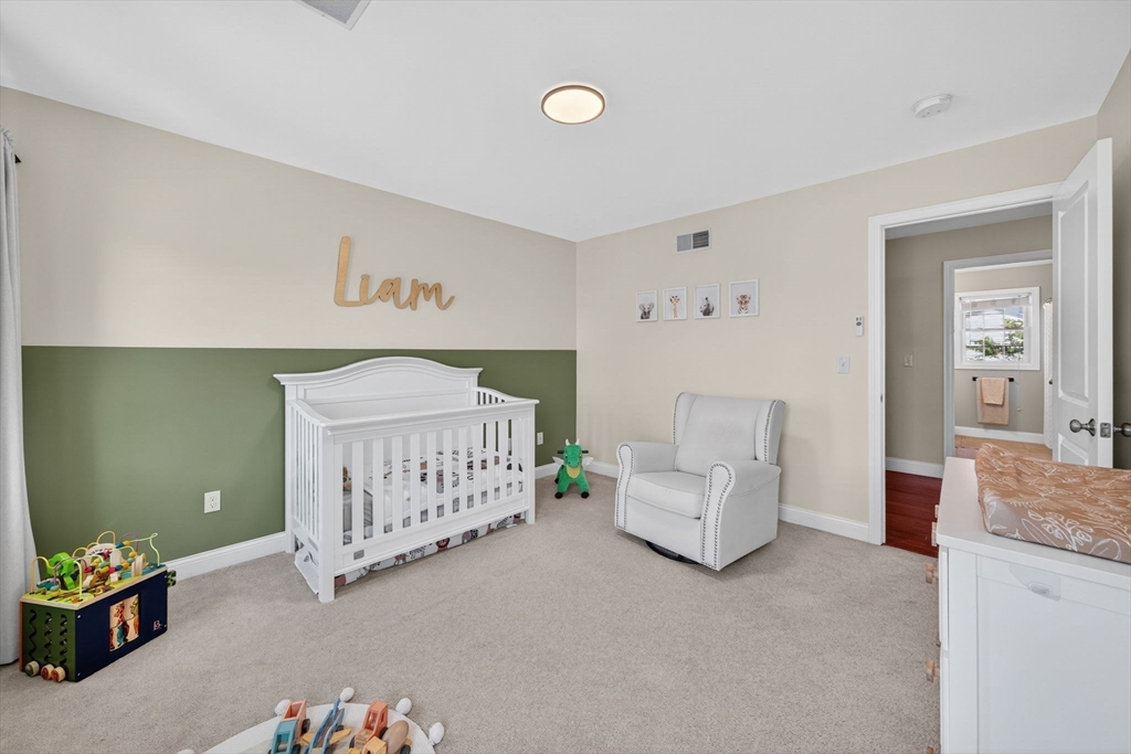 750 Cambridge Street Fall River, MA 02721 - Photo 19 of 38 a bedroom with a baby bed baby crib and a dresser