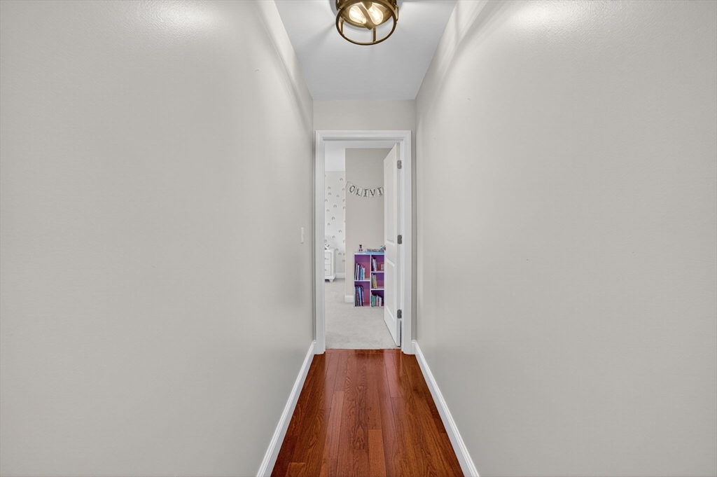 750 Cambridge Street Fall River, MA 02721 - Photo 24 of 38 a view of a hallway with wooden floor