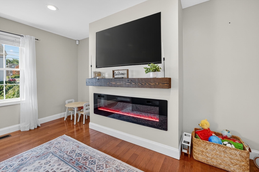 750 Cambridge Street Fall River, MA 02721 - Photo 8 of 38 a living room with furniture and a flat screen tv