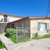 a view of a house with a street