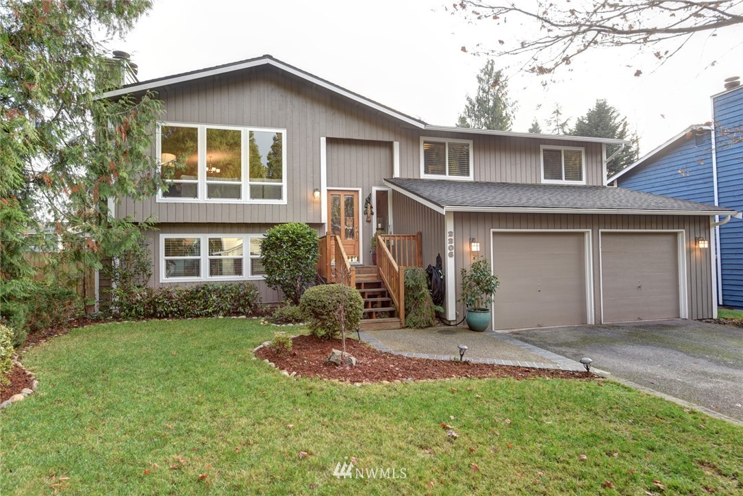 2206 168th Street Southeast Bothell, WA 98012 - Photo 1 of 21 a front view of a house with a yard and porch