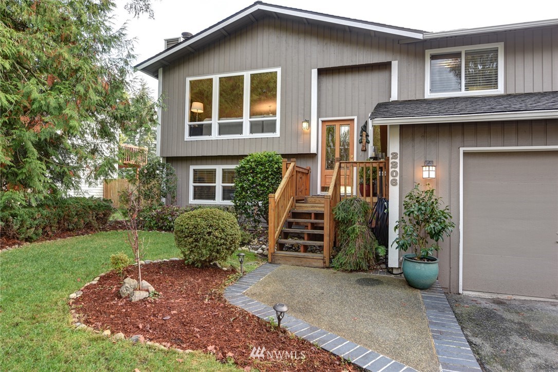 2206 168th Street Southeast Bothell, WA 98012 - Photo 2 of 21 a front view of a house with garden