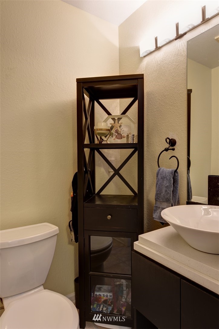 2206 168th Street Southeast Bothell, WA 98012 - Photo 11 of 21 a bathroom with a toilet sink and mirror