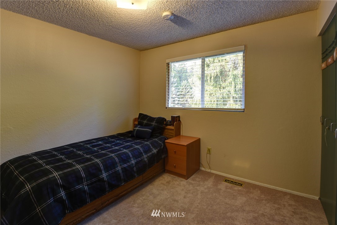 2206 168th Street Southeast Bothell, WA 98012 - Photo 13 of 21 a bedroom with a bed and a window
