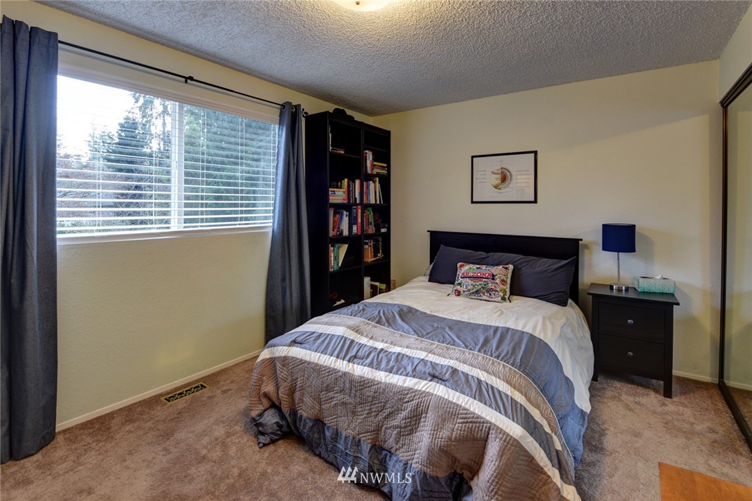 2206 168th Street Southeast Bothell, WA 98012 - Photo 10 of 21 a bedroom with a bed and a window