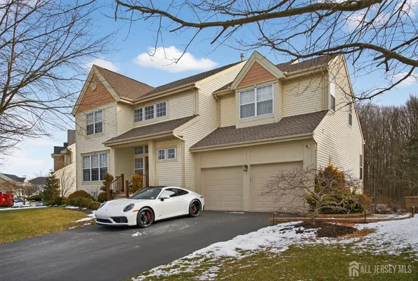 a view of a car park in front of a house