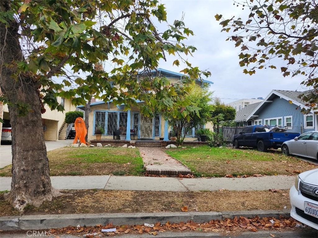 a front view of a house with garden